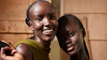 two models smiling and glowing wearing makeup primer