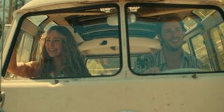 Jessica Rothe as Sarah and Callum Kerr as Everett, seen through the windshield of a '70s van, in episode 602 of Virgin River.