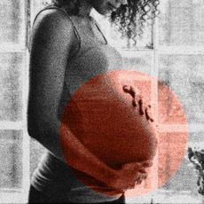 Pregnant woman with hands on her belly