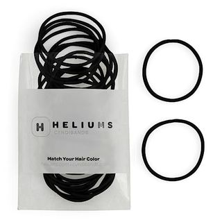 Heliums Thin Hair Elastics in a translucent package with two loose ones beside it on a white background