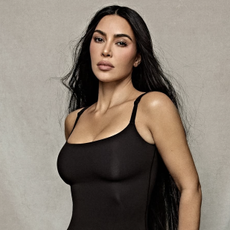 kim kardashian wears a black skims tank top