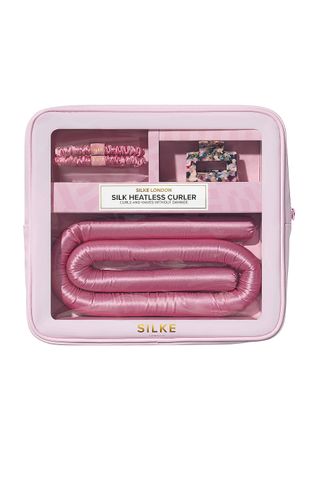 SILKE London Heatless Curler in its package with two hair bands and a clip on a white background