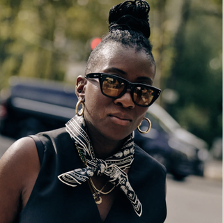 Nikki Ogunnaike wearing a scarf and sunglasses 