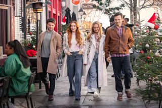 Rudnitsky as Cameron, Lindsay Lohan as Avery, Katie Baker as Cassie and Ian Harding as Logan walking down a christmasy small town street in the movie our little secret