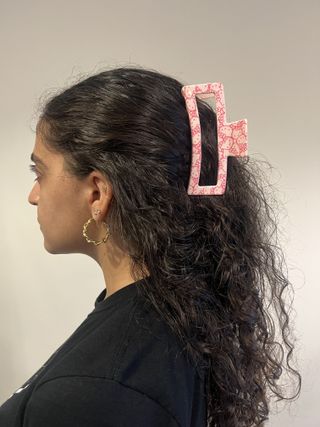 photo of Gabrielle Ulubay from the back with her hair half-up in a claw clip