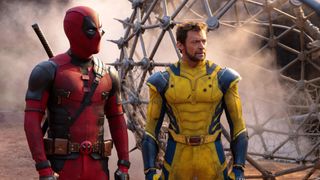 deadpool and wolverine stand by an epcot like structure after an explosion