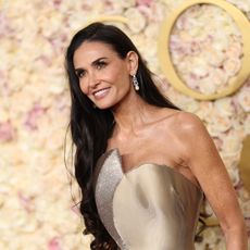 demi moore wearing a gold dress during 2025 golden globes 