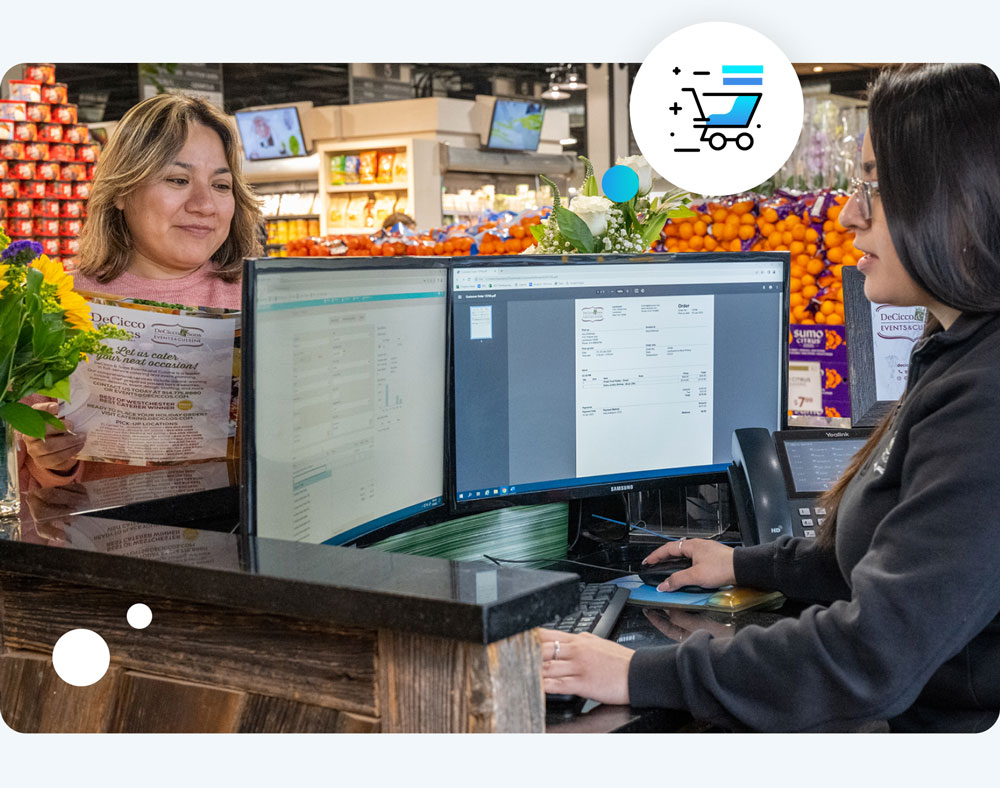 blonde woman ordering catering on an in-store kiosk with tablet