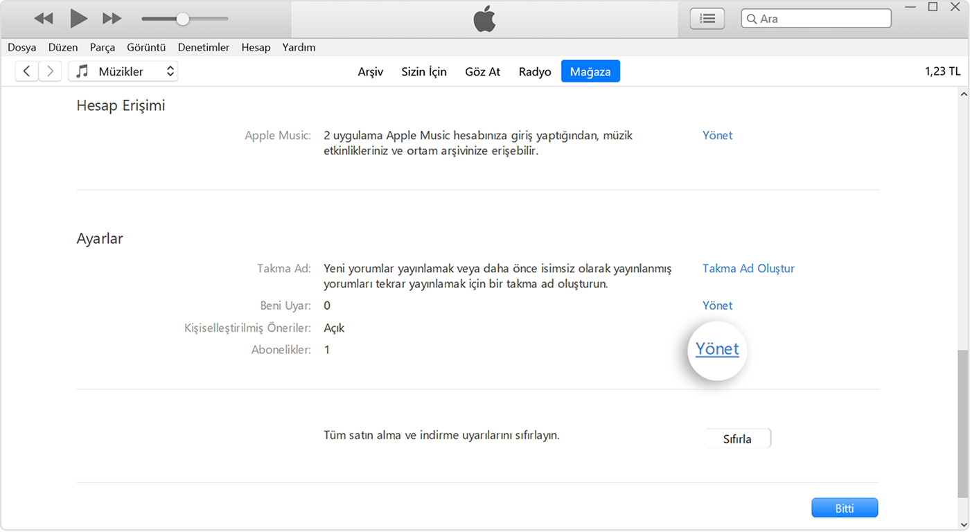 iTunes'da Abonelikler'in yanında bulunan Yönet düğmesi.