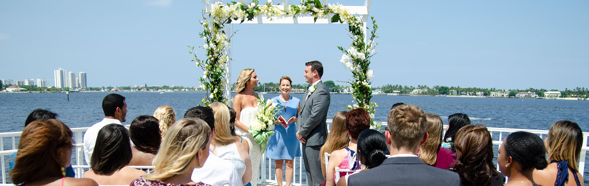 Couple exchanging wedding vows at Manatee Lagoon