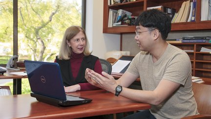 Jean Ensminger meeting with a student