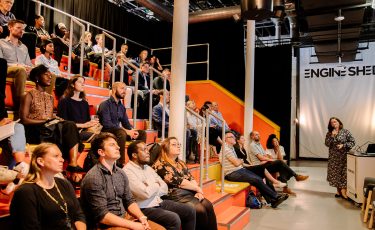 People attending a presentation in The Junction