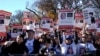 FILE - Jewish Americans and supporters of Israel hold signs as they gather in solidarity with Israel and protest against antisemitism during a rally on the National Mall in Washington, Nov. 14, 2023.