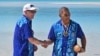 Australia's Prime Minister Anthony Albanese, left, and Tuvalu's Prime Minister Kausea shake hands on One Foot Island after attending the Leaders' Retreat during the Pacific Islands Forum in Aitutaki, Cook Islands, Nov. 9, 2023.