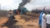 FILE - This video grab from footage provided by the Niger State Emergency Management Agency shows flames and smoke billowing from a fuel tanker that exploded after colliding with a truck in Niger state's Agaie local government district on Sept. 8, 2024.