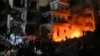 FILE - People gather near buildings hit by an Israeli airstrike in Beirut, Lebanon, Oct. 10, 2024. The U.S. Department of Homeland Security announced Thursday new guidelines offering temporary immigration protection that allow some Lebanese nationals to stay and work in the U.S. 