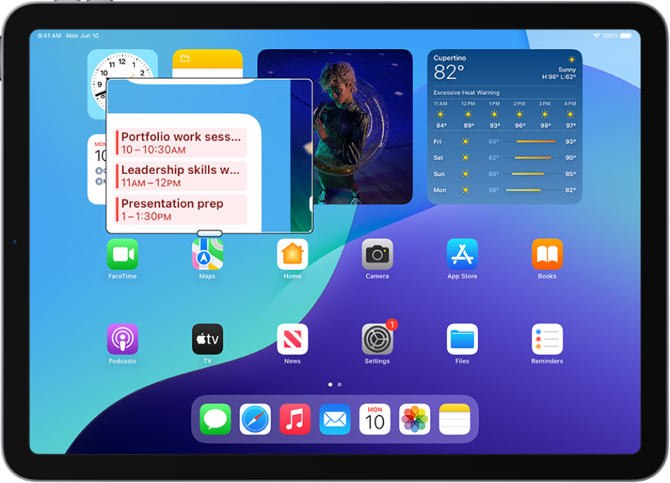 An iPad showing the Home Screen with a window zoomed in on a part of the screen.