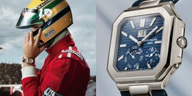 formula 1 driver in racing gear checking a luxury watch