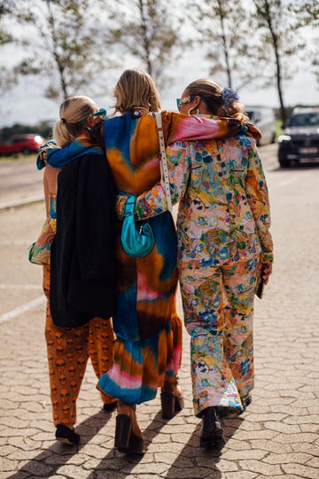 a group of women wearing colorful dresses