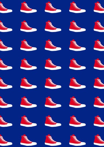 Repeated pattern of red hightop sneakers on a navy background