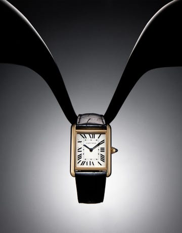 elegant rectangular watch with a gold case and black leather strap