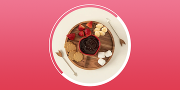 heart fondue set with strawberries, marshmallows, cookies and chocolate