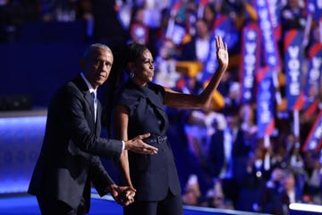 chicago, illinois august 20 former us president barack obama l gestures to former first lady michelle obama as he arrives to speak on stage during the second day of the democratic national convention at the united center on august 20, 2024 in chicago, illinois delegates, politicians, and democratic party supporters are gathering in chicago, as current vice president kamala harris is named her partys presidential nominee the dnc takes place from august 19 22 photo by joe raedlegetty images