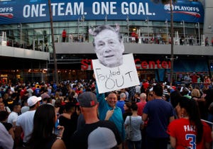 LOS ANGELES, CA.-APRIL 29, 2014: Longtime Clippers fan Abe Dilanian, center, of Northridge, holds a