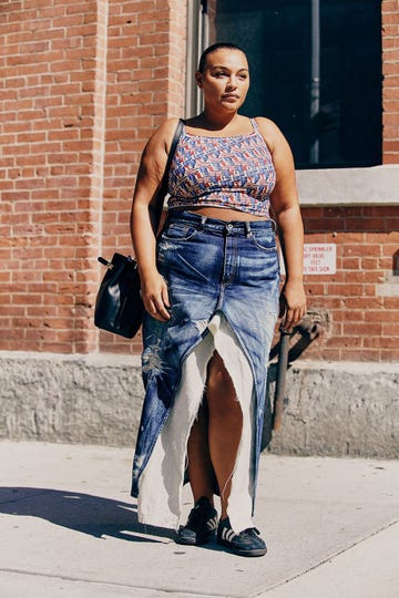 paloma elsesser wears a denim maxi skirt with a tank top in a roundup of the best plus size clothing 2023