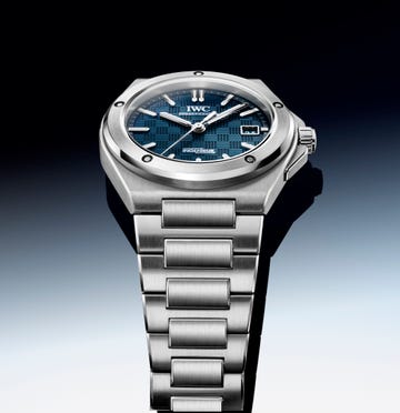 A luxury watch showcasing a blue patterned dial and stainless steel bracelet