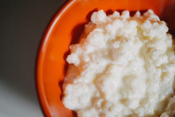 kefir grains in porcelain red bowl from above