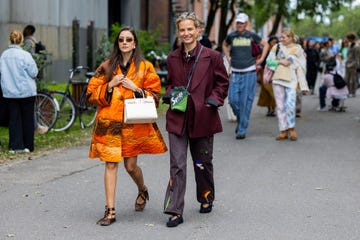 two women in street style day 4 copenhagen fashion week springsummer 2024 wearing ballet flats to illustrate a guide to the best flats for wide feet