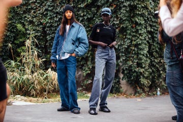 two models at milan fashion week wear head to toe denim outfits to illustrate a story about sustainable denim