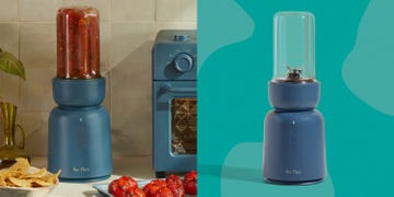 blue blender with tomatoes in it