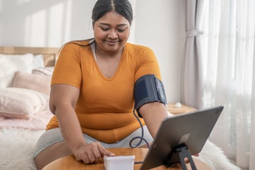 woman doing a blood pressure gauge