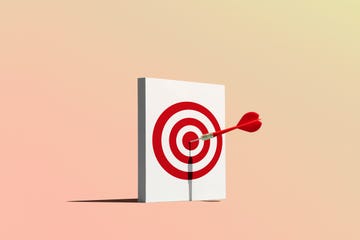 dart in bullseye of target