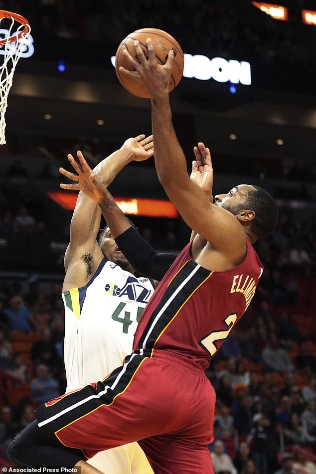 Miami Heat guard Wayne Ellington (2) goes to the basket against Utah Jazz guard Donovan Mitchell (45) during the first half of an NBA basketball game, Sunday, Jan. 7, 2018, in Miami. (AP Photo/Joel Auerbach)