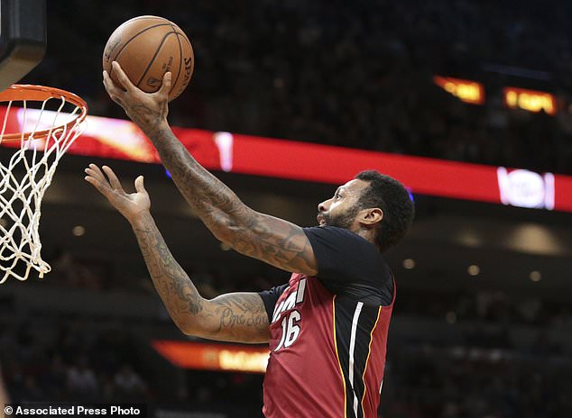 Miami Heat forward James Johnson (16) scores against the Utah Jazz during the first half of an NBA basketball game, Sunday, Jan. 7, 2018, in Miami. (AP Photo/Joel Auerbach)