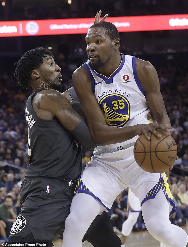 Golden State Warriors forward Kevin Durant (35) drives against Brooklyn Nets forward Rondae Hollis-Jefferson during the first half of an NBA basketball game in Oakland, Calif., Tuesday, March 6, 2018. (AP Photo/Jeff Chiu)