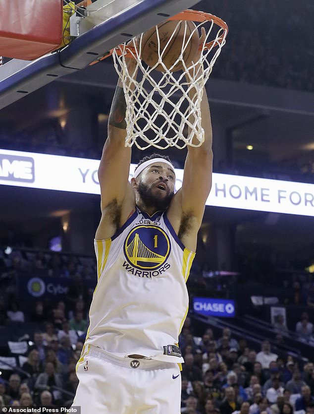 Golden State Warriors center JaVale McGee dunks against the Brooklyn Nets during the first half of an NBA basketball game in Oakland, Calif., Tuesday, March 6, 2018. (AP Photo/Jeff Chiu)