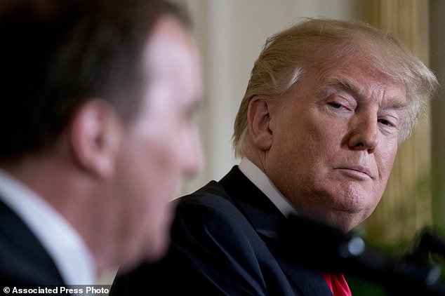 President Donald Trump, center, listens as Swedish Prime Minister Stefan Lofven, left, speaks during a news conference in the East Room of the White House, Tuesday, March 6, 2018, in Washington. (AP Photo/Andrew Harnik)