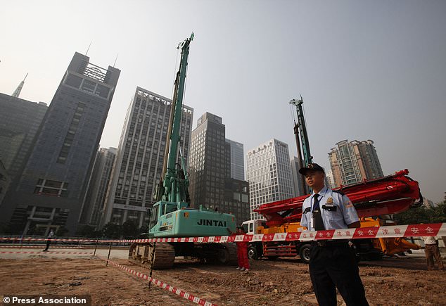 Security workers at the construction site of the US consulate compound in Guangzhou in 2009 (Chinatopix via AP)