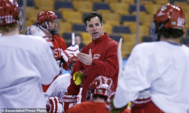 FILE - In this April 5, 2015, file photo, Boston University head coach David Quinn talks to his players during an NCAA hockey practice before the Frozen Four tournament in Boston. The New York Rangers have hired Boston University's David Quinn as their new head coach. General manager Jeff Gorton announced the long-reported move Wednesday, May 23, 2018. (AP Photo/Charles Krupa, File