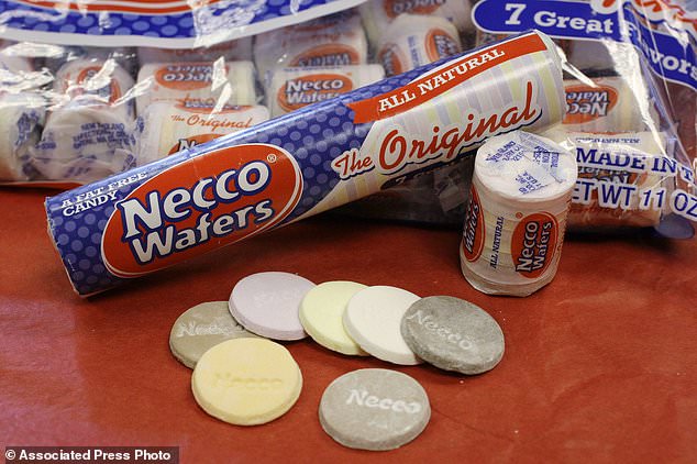 FILE - In this Oct. 14, 2009 file photo, Necco Wafers are displayed in Boston. Four bidders are vying to buy New England Confectionery Company, of Revere, Mass., the bankrupt manufacturer of Necco Wafers, Sweethearts and other iconic candies. A bankruptcy auction is scheduled for Wednesday, May 23, 2018. Necco said in March is will close and lay off hundreds of workers if a buyer isn't found. The company traces its roots to 1847 and calls itself the nation's oldest continuously operating candy company. (AP Photo/Charles Krupa, File)