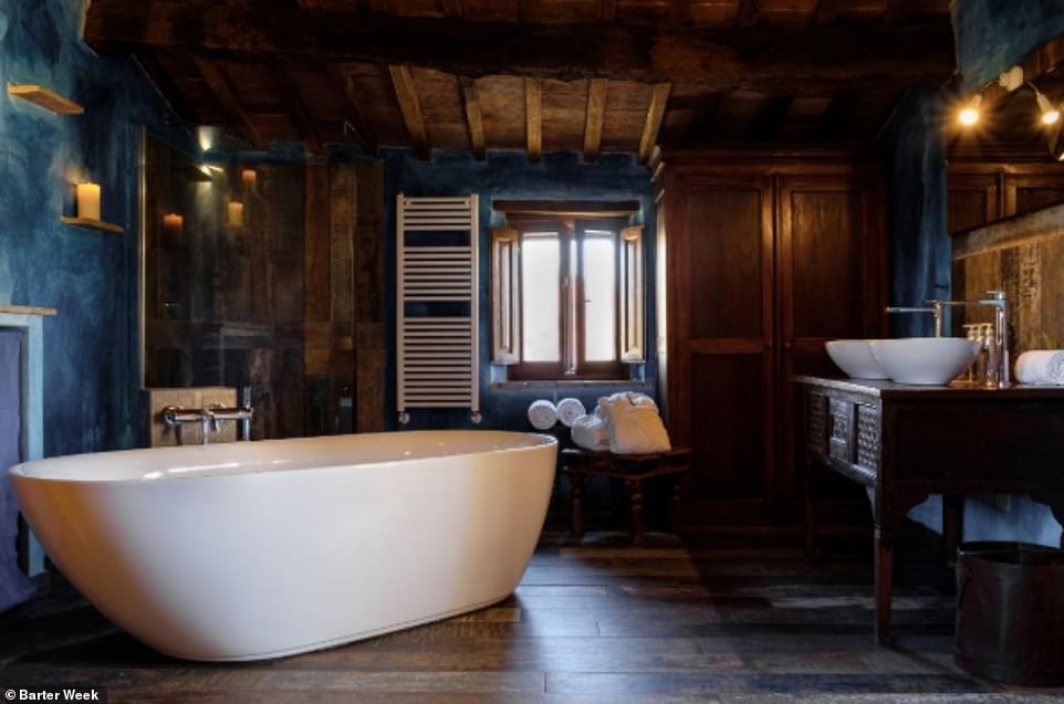 The luxurious bathroom inside the Sant'Egle Organic Farm accommodation in Tuscany, where rooms cost around £115 per night. The owners are willing to consider all offers. There are 316 B&Bs in Italy taking part in Barter Week 