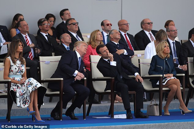 President Donald Trump and his wife Melania Trump, French President Emmanuel Macron and his wife Brigitte Trogneux congratul the traditional Bastille day military parade on the Champs-Elysees on July 14, 2017 in Paris France. Trump said he was impressed with the parade and spoke of holding one in the U.S.