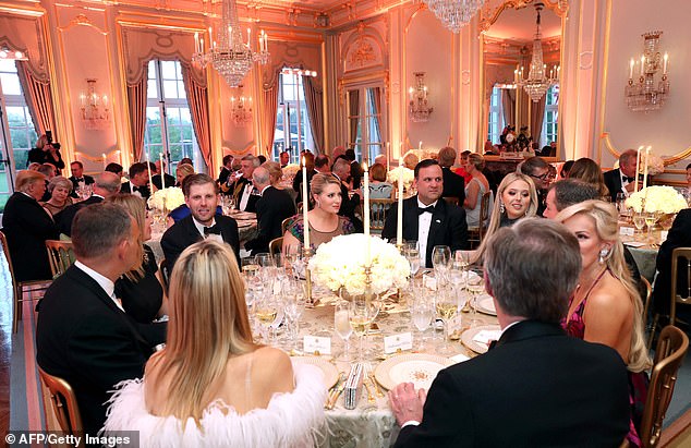 Tiffany, Lara, and Eric all sat together at a different table nearby