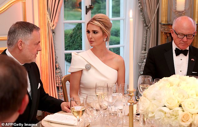 Inside, Ivanka appeared serious as she spoke with others at her table