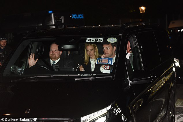 Vehicles bearing stickers with the US flag pulled out after dark on Tuesday