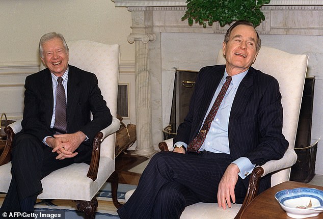 After Carter lost to Ronald Reagan, he and his wife, Rosalynn, founded the Carter Center in 1982, partnering with Emory University in Atlanta. The nonprofit's mission is to 'advance peace and health worldwide,' with numerous programs and democratic initiatives. Carter, left, and President George H W Bush, right, in the Oval Office on April 1, 1992. A reporter had asked who Carter was supporting in the 1992 presidential election between Bush and the Democratic nominee Bill Clinton. Carter, a Democrat, had said Clinton to laughs